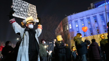 A Yoon supporter holds up a sign telling the Moon government to get out of Korean’s lives. 