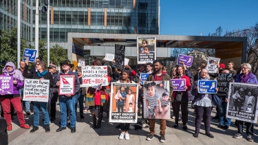 Protesters outside the Federal Court on Wednesday, showing support for the Tamil family.