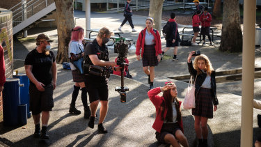 Nathalie Morris (centre) filming a scene at Sydney Secondary College for season one of Bump. 