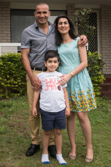 New life: Kosar, Eric and Hossain at home in Brisbane.