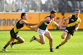 Darcy Tucker runs clear of the Tigers.