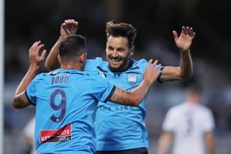 Milos Ninkovic celebrates with Bobo but was later taken off with injury.
