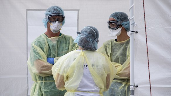 Medical workers near Milan in northern Italy prepare to treat more patients. 