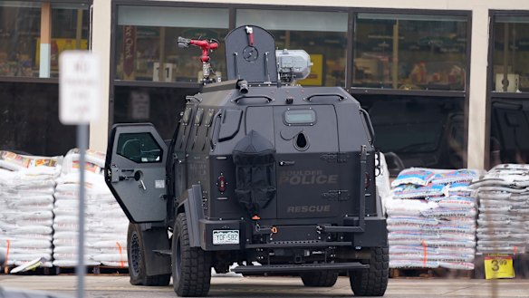 Police work on the scene outside a grocery store where a shooting took place.