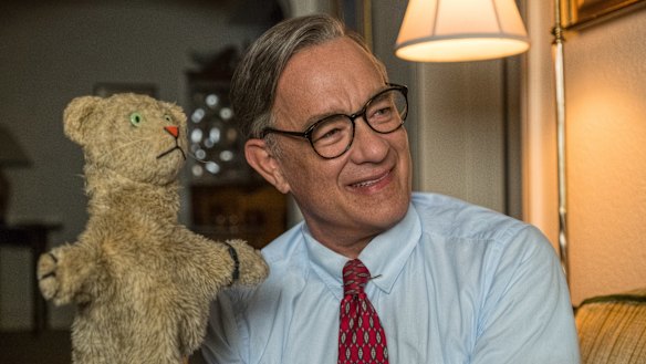 Tom Hanks as the jovial Fred Rogers in A Beautiful Day in the Neighborhood.