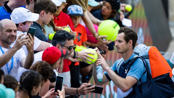 Andy Murray signs autographs for the fans after his win over Nick Kyrgios.