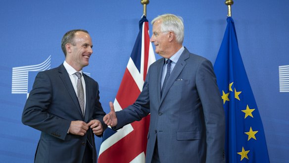 Dominic Raab, the UK Brexit secretary, left and Michel Barnier, chief negotiator for the European Union), shake hands following a news conference in Brussels, Belgium, on Friday.
