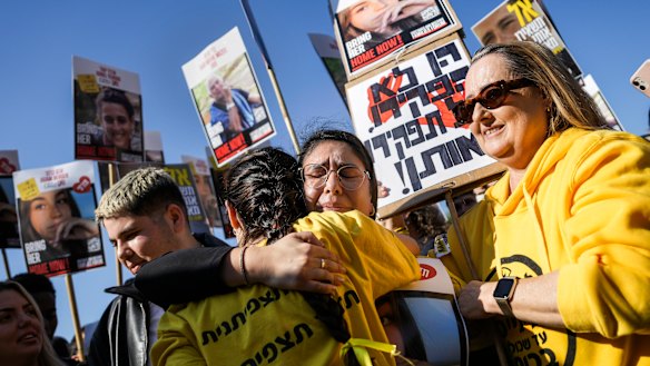 People react as they watch broadcast of the release of Israeli soldier Agam Berger, one of the eight hostages freed on Thursday.