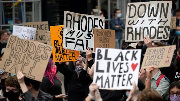 Thousands demonstrate outside  Oriel College, Oxford, demanding the removal of a statue of Cecil Rhodes.