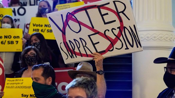 A group opposing new voter legislation gather outside the House Chamber at the Texas Capitol.