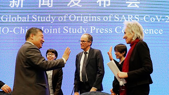 The World Health Organisation team say farewell to their Chinese counterparts after the WHO-China Joint Study Press Conference on Tuesday. 