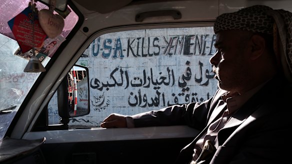 Anti-American graffiti on the street in Sanaa after the war started in 2015.