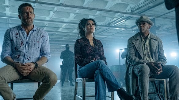 Ryan Reynolds (left), Salma Hayek and Samuel L. Jackson in a scene from The Hitman’s Wife’s Bodyguard.