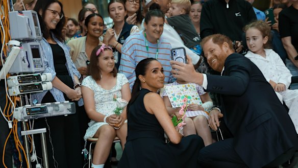 Prince Harry and Meghan Markle take a selfie with kids at The Royal Children’s Hospital in Melbourne on Tuesday.