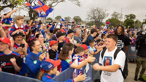 Newcastle Knights supporters see off their team on Saturday morning.
