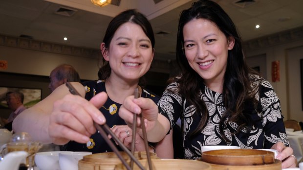 Nancy and Lucy Chen, owners of Mr Chen's, sample the dumplings at Shark Fin House in Melbourne's China Town ahead of Chinese New Year. 