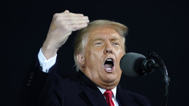 US President Donald Trump speaks at a campaign rally at Des Moines International Airport in Des Moines, Iowa.