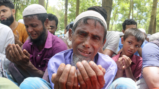 Rohingya refugees cry while praying during a gathering at Cox’s Bazar last August to mark the fifth anniversary of their exodus from Myanmar to Bangladesh.