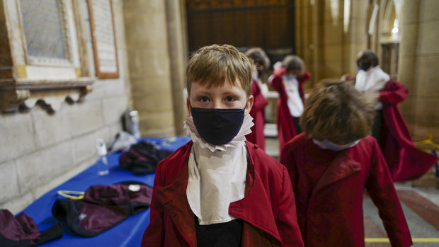 Young choristers wear masks as they prepare for the the Good Friday morning choral service, which took place without members of the public present due to Covid-19 regulations, at Truro Cathedral in Truro, England. 