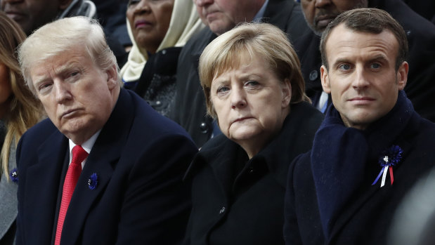 French President Emmanuel Macron, German Chancellor Angela Merkel and President Donald Trump attend a commemoration ceremony for Armistice Day in Paris.