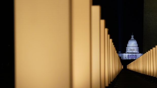 Lights surround the Lincoln Memorial Reflecting Pool, placed as a memorial to COVID-19 victims in Washington. 