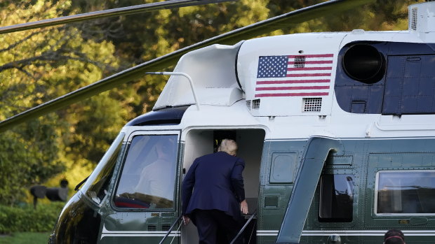 US President Donald Trump boards Marine One as he leaves the White House to go to Walter Reed National Military Medical Centre.