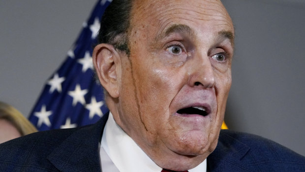 Hair dye runs down the face of Donald Trump’s personal lawyer Rudy Guiliani  during a press conference in November. 