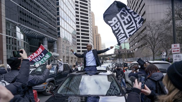 People celebrate outside the Minneapolise courthouse on Tuesday.