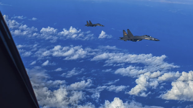 Chinese fighter pilots conduct combat training exercises around Taiwan.