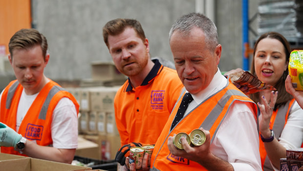 Federal Opposition Leader Bill Shorten helps pack boxes at Foodbank in Melbourne this week.