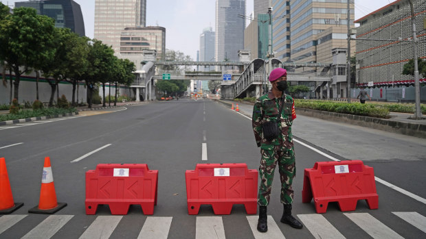 Military and police are being deployed to enforce movement restrictions in Jakarta.