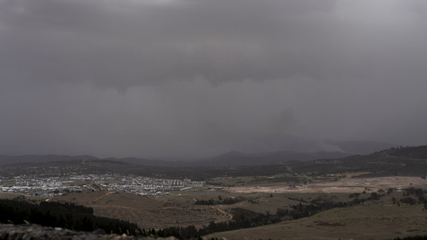 The view from the National Arboretum on Friday afternoon. Canberra battled smoke, strong winds and rain.
