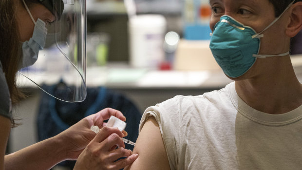 A man receives the Pfizer-BioNtech COVID-19 vaccine at the Providence Alaska Medical Centre in Anchorage, Alaska.