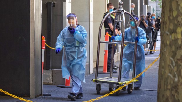 Staff in protective gear at the Holiday Inn in Flinders Lane on Tuesday.