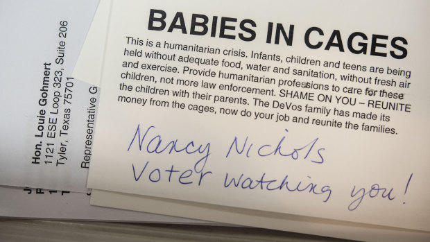 The US government has been criticised for its treatment of migrants in Texas, as can be seen in this voter's postcard signed in 2019.