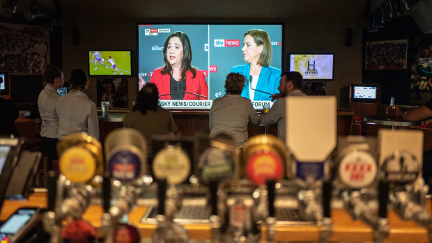 People watching the debate on TV between Queensland Premier Annastacia Palaszczuk and Opposition Leader Deb Frecklington at the Broncos Leagues Club.