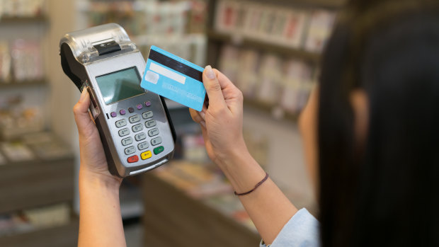 Small businesses are often forced to pass on the cost of the electronic payment system to shoppers.