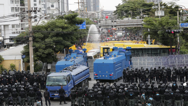 Police use water cannons to disperse pro-democracy demonstrators near the Parliament in Bangkok on Tuesday.