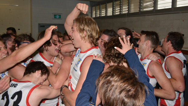 The Canberra Demons celebrate their first NEAFL finals win.