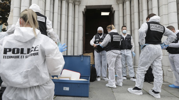 Forensic officers prepare to inspect the Notre-Dame Basilica in Nice on Thursday.