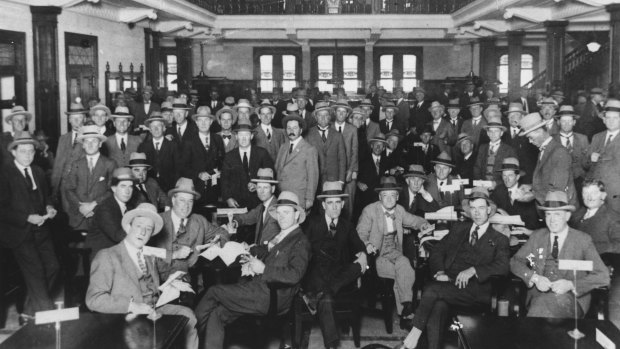 A Supreme Court case is challenging the validity of a vote to allow women to become members of the Tattersall's Club. Pictured is settling day at the club for bookmakers and clients in 1926.