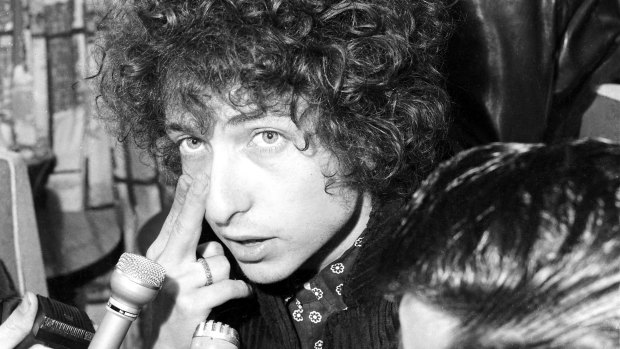 Singer Bob Dylan speaks to reporters at Sydney's Mascot Airport on 12 April 1966.  