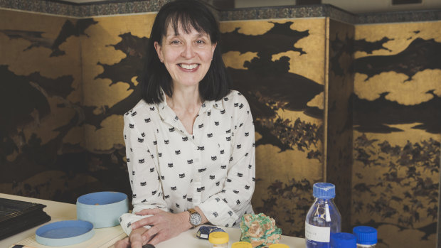 Andrea Wise, NGA Senior Conservator of Works on Paper, with a 16th Century Japanese screen, ‘The Imperial Outing and Hunt’ Monoyama Period (1573–1615).