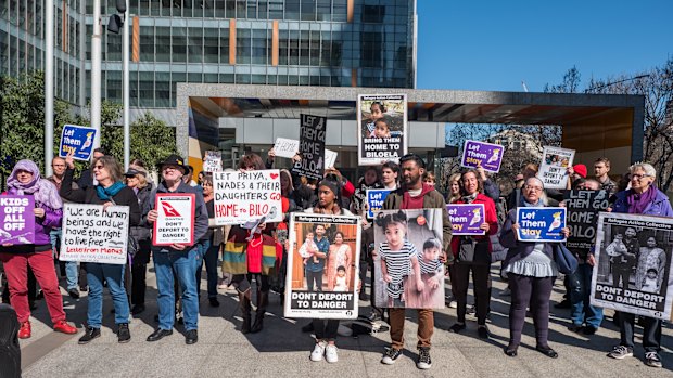 Protesters outside the Federal Court on Wednesday, showing support for the Tamil family.