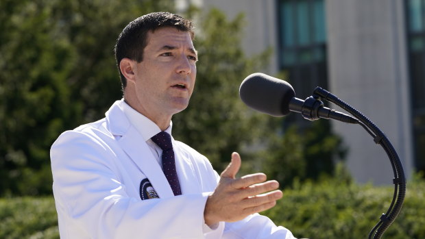 Dr. Sean Conley, physician to President Donald Trump, briefs reporters at Walter Reed hospital. 