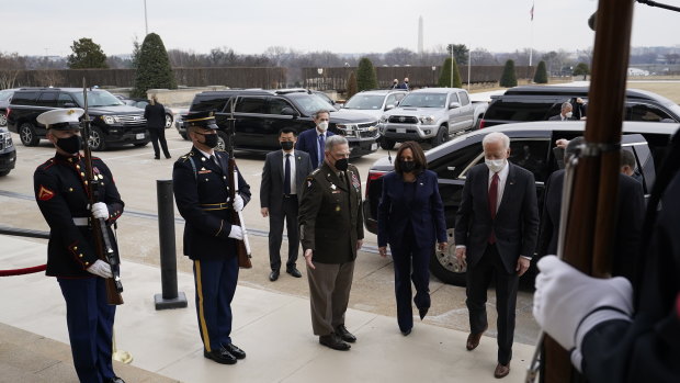 US President Joe Biden, from right, Vice-President Kamala Harris and Mark Milley, chairman of the joint chiefs of staff, arrive at the Pentagon in Arlington, Virginia.