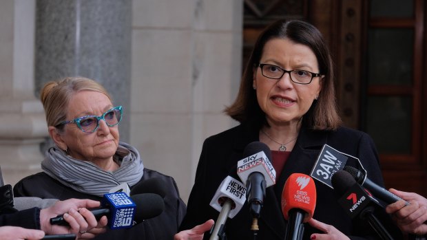 Chair of the Voluntary Assisted Dying Review Board, former Supreme Court Judge Betty King QC (left), speaks with Victorian Health Minister Jenny Mikakos.