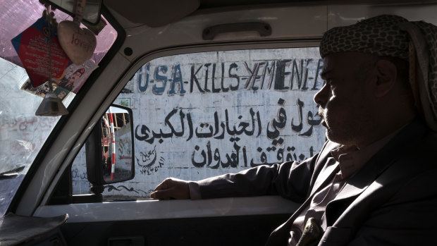 Anti-American graffiti on the street in Sanaa after the war started in 2015.