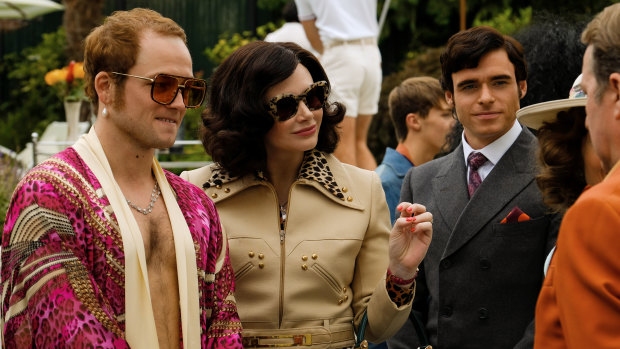 Taron Egerton as Elton John, Bryce Dallas Howard as  Elton's mother Sheila Farebrother and Richard Madden as John Reid in Rocketman.