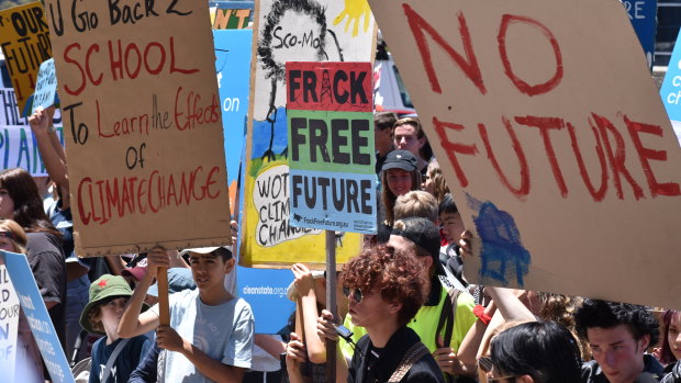 Students protest government inaction on climate change at WA Parliament House on Friday afternoon.